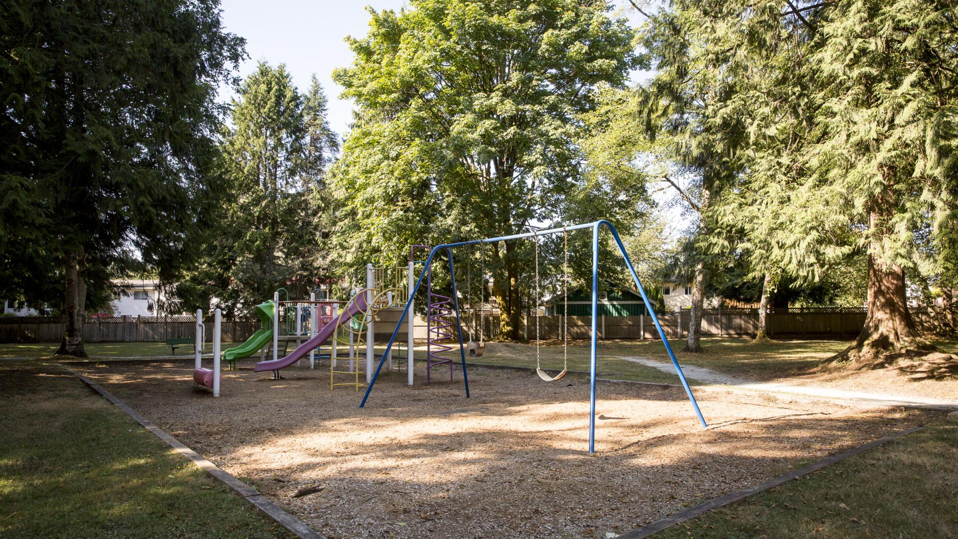 A small playground and swing set.